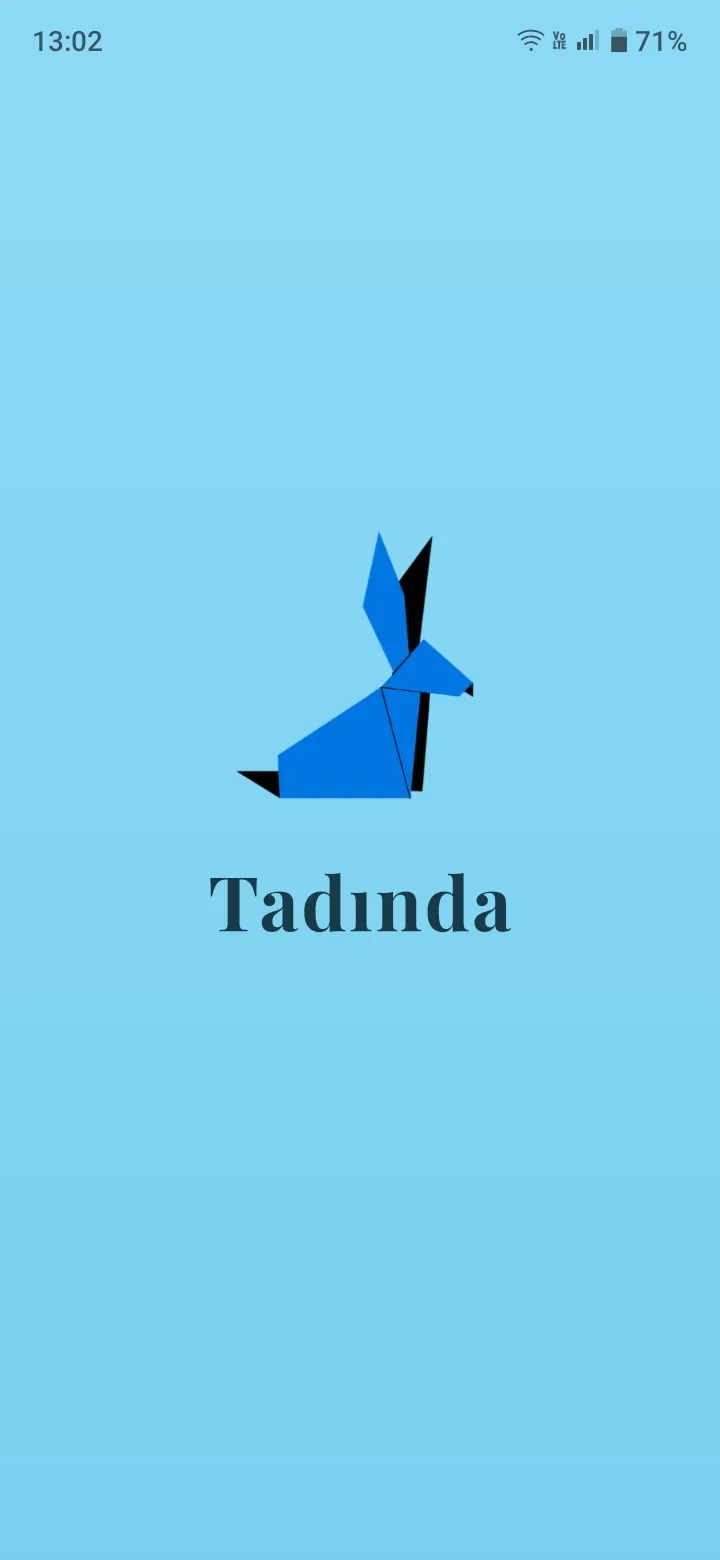 Tadinda mobil uygulamasının açılış ekranı: origami tavşan logosu
